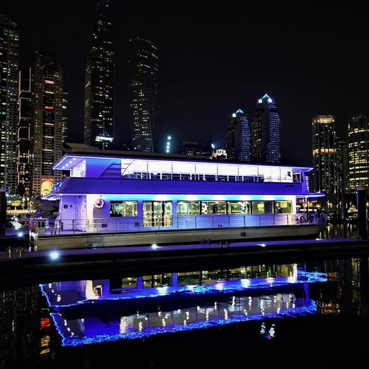 Experience a luxurious catamaran dinner cruise in Dubai Marina with live entertainment, delicious Arabian cuisine, and private hotel transfers.